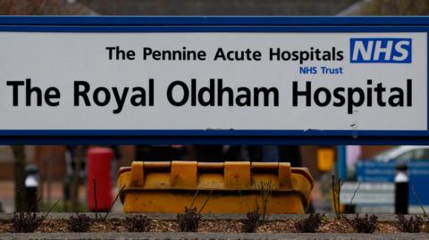 The front entrance sign for The Royal Oldham Hospital.