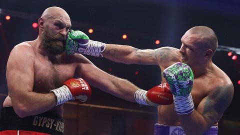 Tyson Fury being jabbed by Oleksandr Usyk