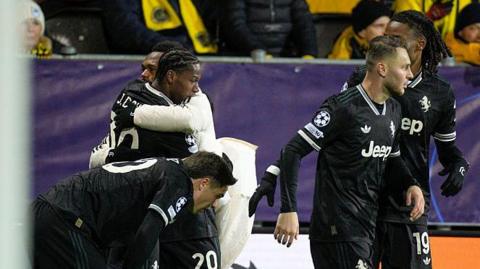 Juventus players celebrate Jonathan David's winner