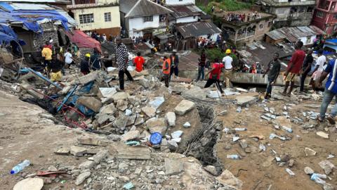 Rescuers search for survivors after a building collapsed in Freetown, Sierra Leone. Photo: 16 September 2024