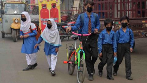 children wearing masks