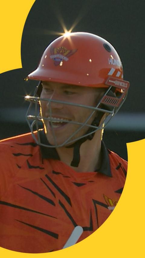 Matthew Revis smiles after hitting a six