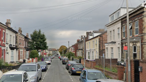 Clifton Road in the Tuebrook area of Liverpool. It is a street lined by terraced houses. 