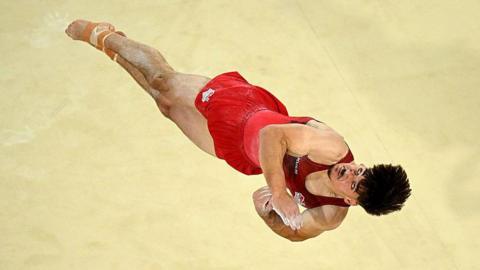 Gabriel Langton of Team England competes in Floor Exercise