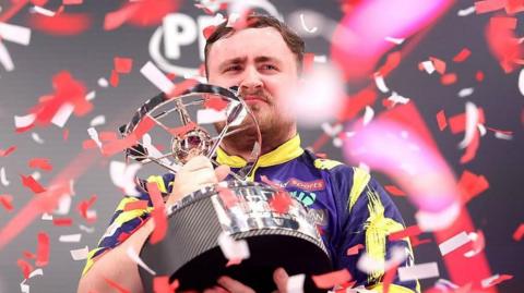 Luke Littler with trophy