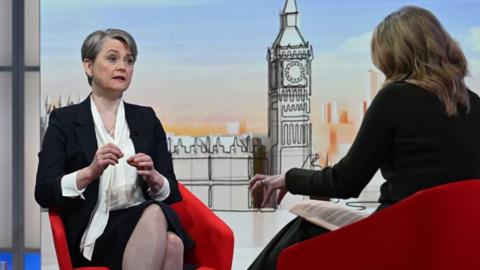 yvette cooper on a red chair talking to Laura Kuenssberg