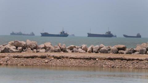 Ships in the distance on the coast line near Iran.
