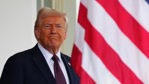 U.S. President Donald Trump waits to greet UK Prime Minister Sir Keir Starmer for a meeting at the White House on February 27, 2025 in Washington, DC. Carl Court/Pool via REUTERS