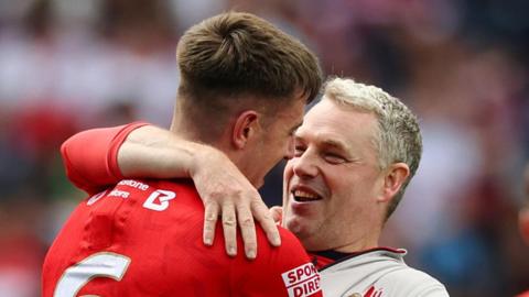 Gavin Devlin embraces Dara McDonnell 