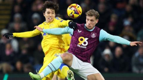 Leeds' Ao Tanaka battles with Burnley forward Zian Flemming