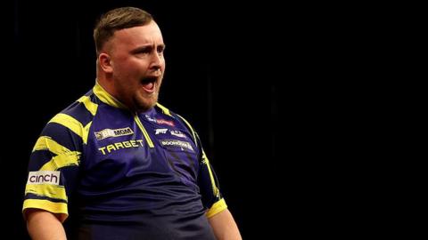 Luke Littler celebrating