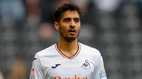 Kyle Naughton in action this season