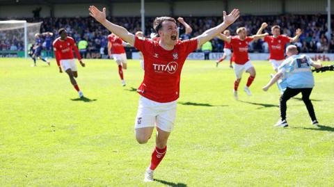 York City's Ryan Fallowfield celebrates at Rochdale