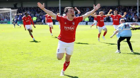 York City's Ryan Fallowfield celebrates at Rochdale