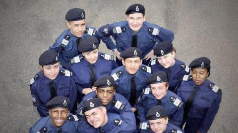 A group of cadets looking up at camera