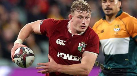 Jac Morgan carrying the ball for Lions