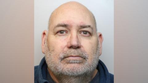 Nicholas Embling, from Oakhurst, Swindon, who committed multiple sex offences against two children. He has grey, receding hair and facial hair. He is looking directly at the camera with a blank expression.