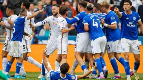 Swansea v Cardiff players fighting 