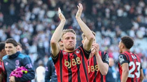 Adrien Truffert applauds the Bournemouth fans