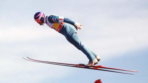 Eddie Edwards flying through the air during a ski jump at the 1988 Calgary Winter Olympics