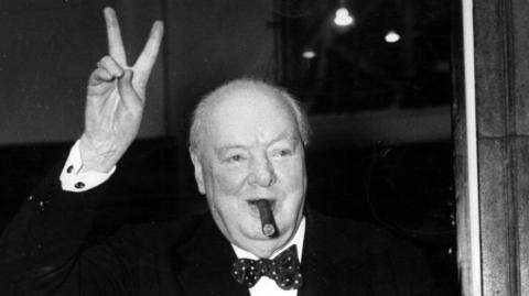 Winston Churchill gives his familiar and famous V for Victory sign after a lunchtime meeting, at Ten Downing Street, with American Secretary of State John Foster Dulles, September 17th 1954.