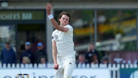 Henry Brookes in action about to bowl for Gloucestershire.