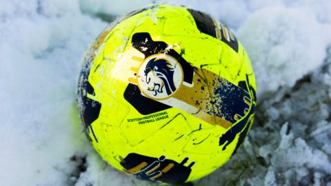 Football in the snow at Aberdeen's training ground