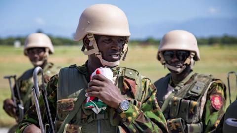 Members of a Kenyan police force, part of a new security mission, stand at the airport after disembarking, in Port-au-Prince, Haiti June 25, 2024