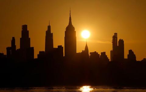 New York skyline with sun.