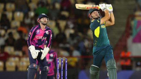 Marcus Stoinis batting as Matthew Cross looks on