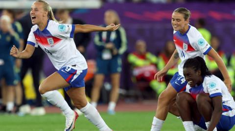 Beth Mead, Grace Clinton and Michelle Agyemang celebrate England's win on penalties