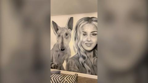 Giant mural of Demi and her dog in black and white