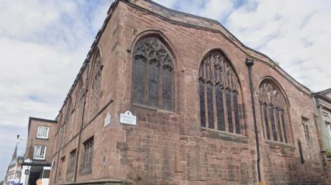 Streer corner shot of historical church in Chester city centre