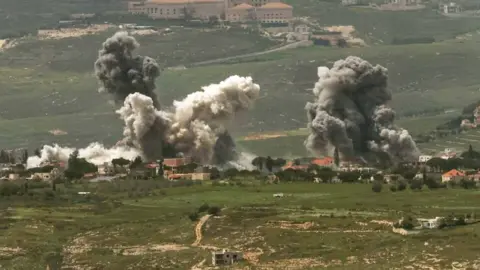 Smoke rises following an Israeli airstrike in a southern Lebanese village, as seen from the Upper Galilee in northern Israel, 26 April 2026