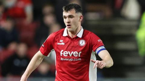 Jason Knight runs with the ball at his feet during a match for Bristol City at Ashton Gate