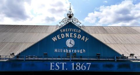 'Sheffield Wednesday Hillsborough' sign on roof with clock