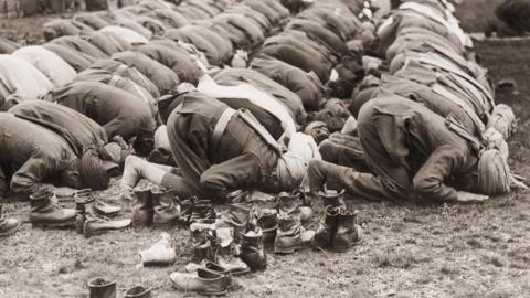 Indian troops serving with the British Army praying outside the Shah Jahan Mosque in Woking, Surrey, during the Muslim festival of Eid al-Adha, in 1916