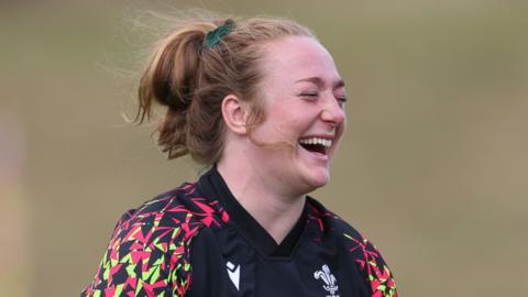 Abbie Fleming laughs during Wales training