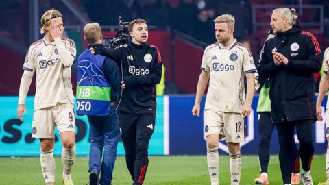 Ajax's players walk off after defeat to Benfica