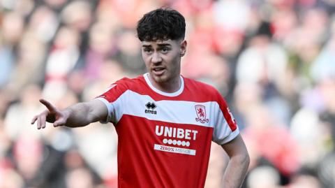 Hayden Hackney pointing with his right hand in the direction of an unseen Middlesbrough player in a match