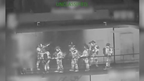 Multiple soldiers are seen holding guns.
