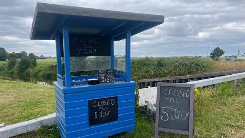 The honesty box stall with a sign saying 218 bags taken without payment