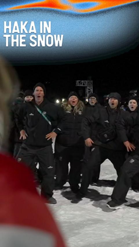 New Zealand staff perform the haka in the snow at the snowboarding big air