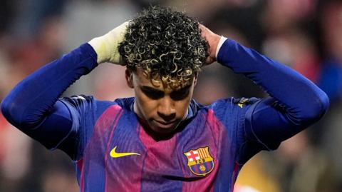 Lamine Yamal puts his hands to his head after missing a penalty