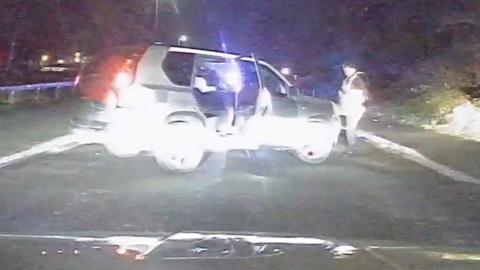 Car in the middle of a road in Nottinghamshire at night