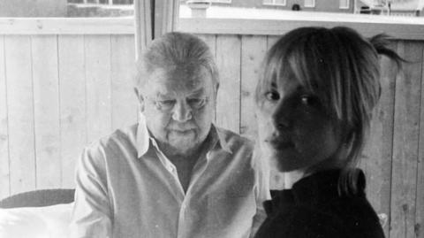 A black and white photo of Rusty Williams and Hayley Williams