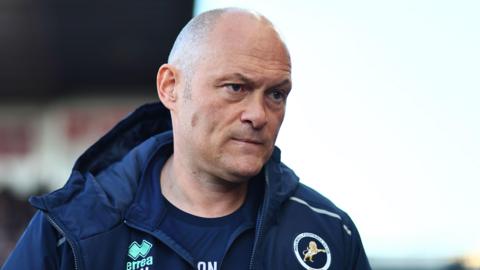 Millwall boss Alex Neil looks on