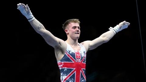 Gymnast Luke Whitehouse reacts after his routine