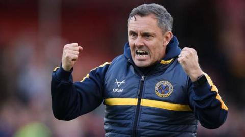 Shrewsbury boss Paul Hurst celebrates a win