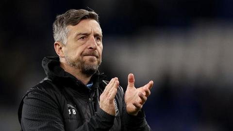 Port Vale boss Jon Brady clapping his hands